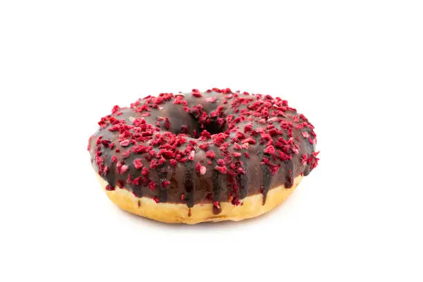Chocolate donut with framboise on white background.