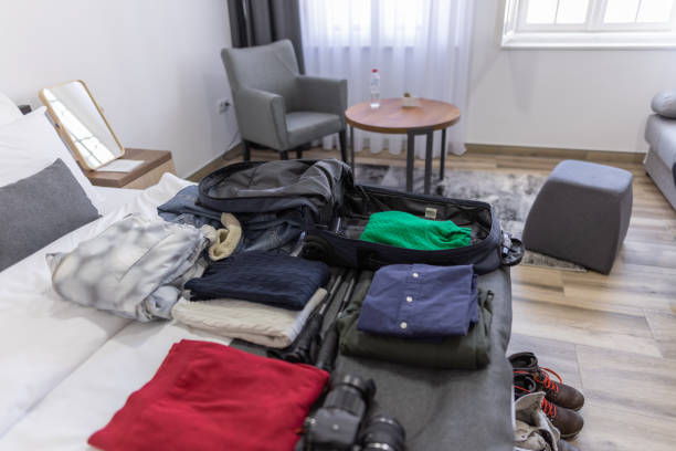 istock Luggage on bed in hotel room 1371341534