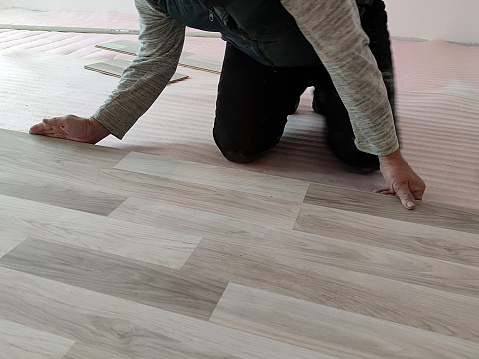 installation of laminate flooring in the living room close-up