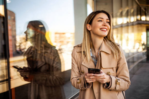 istock Businesswoman outdoors text messaging 1371344800