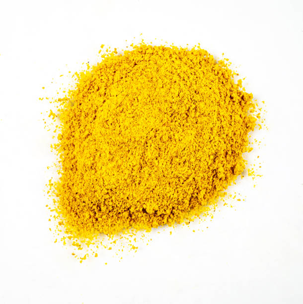 istock Bright aromatic spice turmeric is scattered on a white isolated background. Top view 1371346906