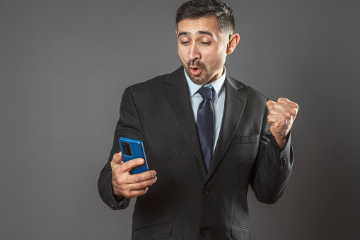 Confused man talking on cell phone