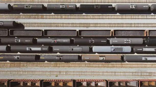 Aerial View of a Train Depo next to a large highway