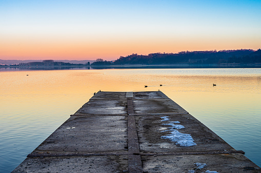 jetty into the lake at sunset.