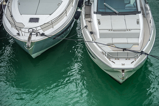 Luxury yachts in calm and transparent waters of Florida.