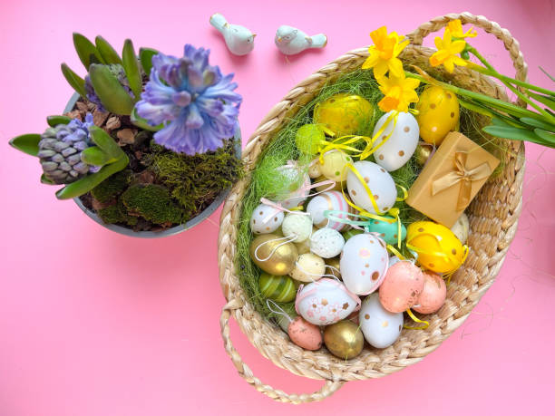 istock Basket with easter eggs with purple hyacinth and daffodils. View from above. 1371352934