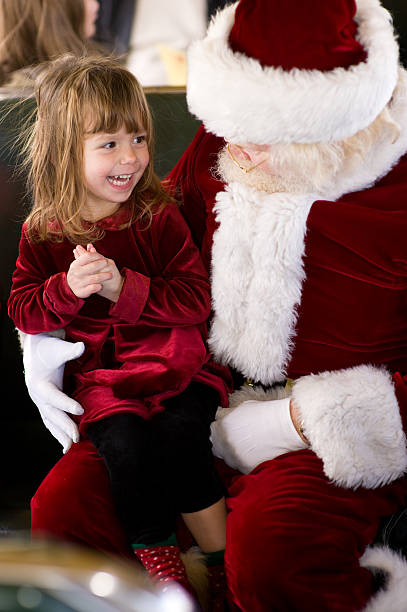Girl Finds Santa on Public Transit stock photo