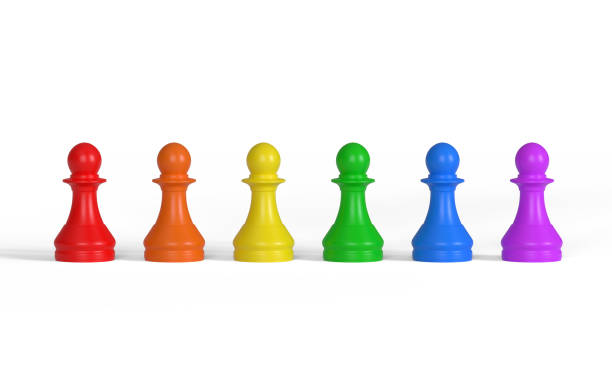 row of multicolored pawns - board game piece leisure games blue isolated imagens e fotografias de stock