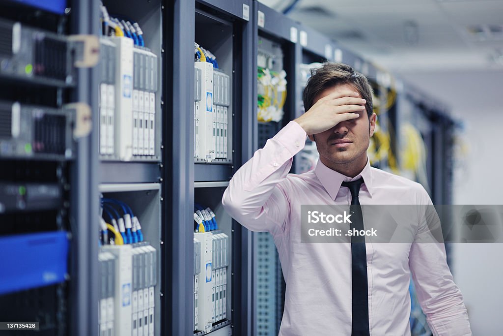 system fail situation in network server room it business man in network server room have problems and looking for  disaster situation  solution Accidents and Disasters Stock Photo