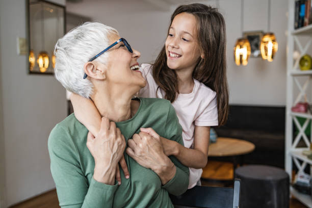 istock Cute girl hugging her grandmother 1371355853