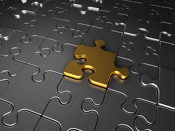 istock Gold and silver jigsaw puzzle pieces 137135646