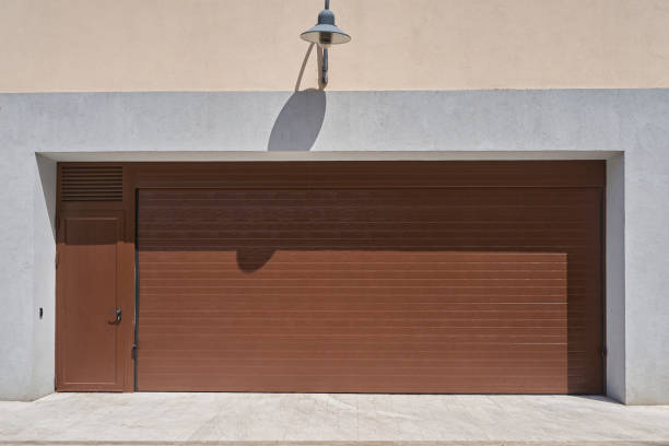 istock Wide rolling garage door with door 1371357626