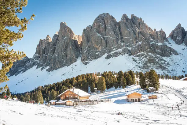 Photo of Odle mountains chain separating the Funes valley from the Gardena valley take from the Gaisler refuge with the South Tyrol flag, Italian Alps, Dolomites, Alto Adige, Sudtirol