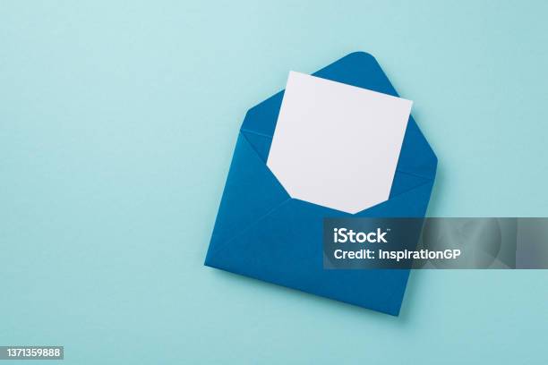 Top View Photo Of Open Blue Envelope With Paper Sheet On Isolated Pastel Blue Background With Empty Space Stock Photo - Download Image Now