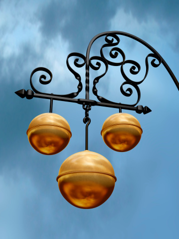 Pawnbroker shop sign with three golden balls