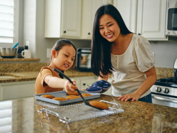 istock Mom and Children Baking Cookies 1371360298