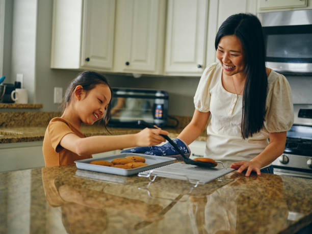 istock Mom and Children Baking Cookies 1371360304