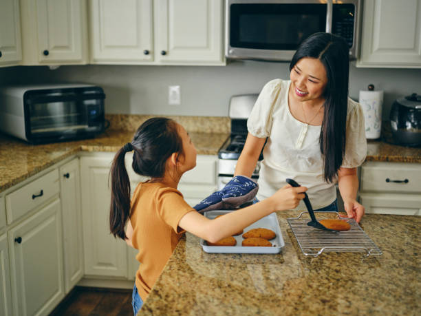 istock Mom and Children Baking Cookies 1371360316
