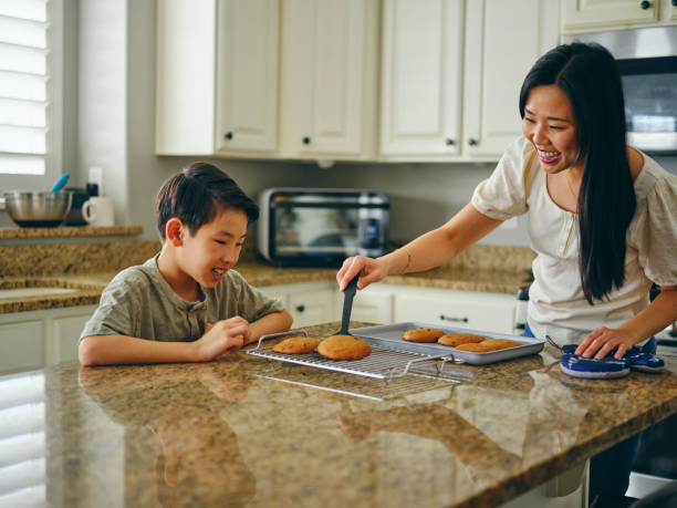 istock Mom and Children Baking Cookies 1371360358