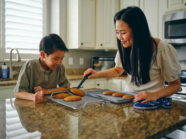 istock Mom and Children Baking Cookies 1371360368