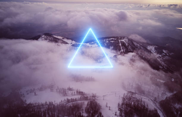 istock Aerial mystical view and stunning neon triangle shape above sunset clouds 1371360377