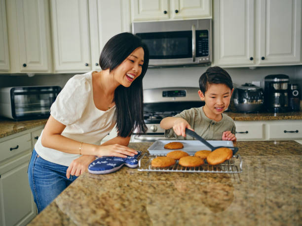 istock Mom and Children Baking Cookies 1371360389