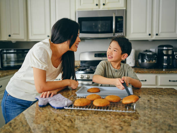 istock Mom and Children Baking Cookies 1371360910