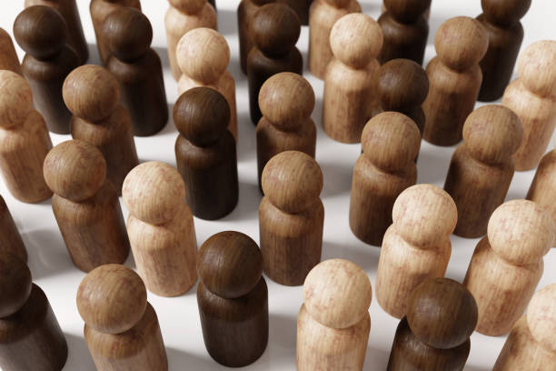 istock Diversity, Equality and Representation Concept. Wooden Doll Figures in Different Shades. 1371367236