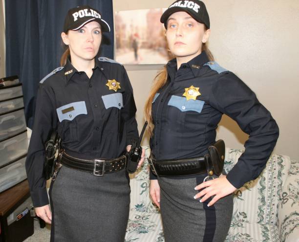 istock Female police officers, blue uniform 1371369996