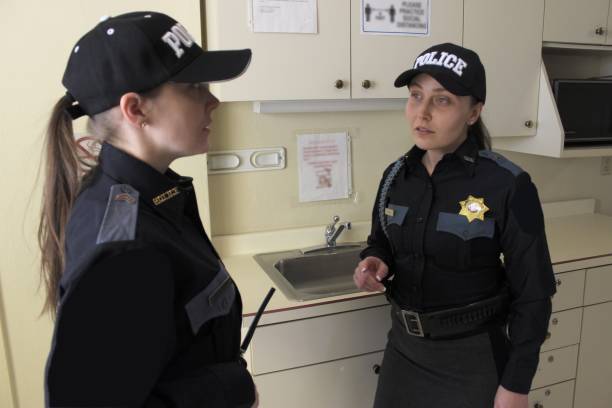 istock two Female police officers, blue uniform 1371370012