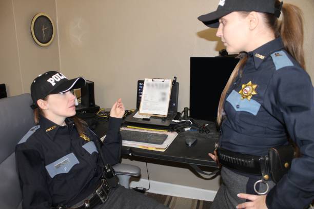 istock two Female police officers, blue uniform 1371370045