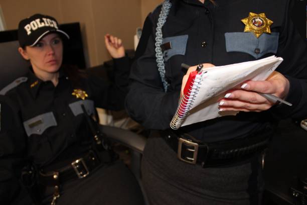 istock two Female police officers, blue uniform 1371370048
