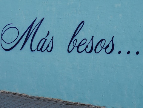 Graffito on turquoise wall