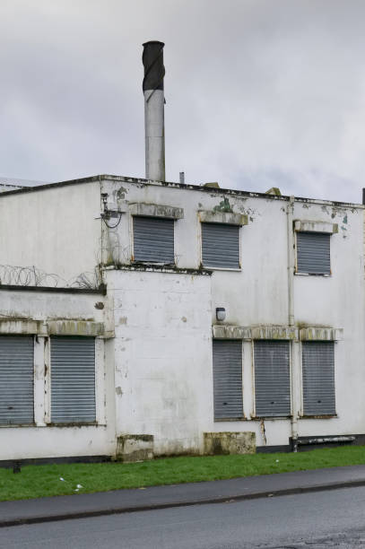 istock Office window shutters closed due to business closure 1371378915