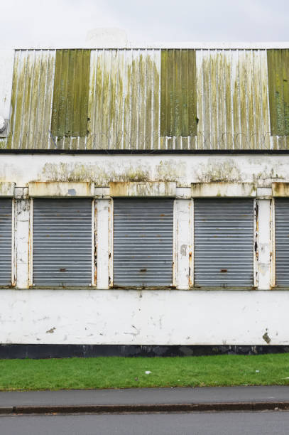 istock Office window shutters closed due to business closure 1371379727