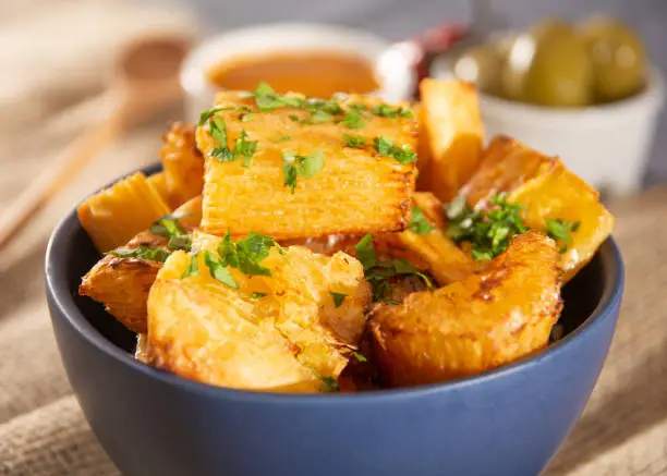 Fried cassava, a Brazilian cuisine food, latin snack. Yucca, yuca, manioca sticks.