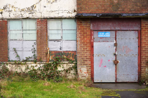 istock Office window shutters closed due to business closure 1371381129