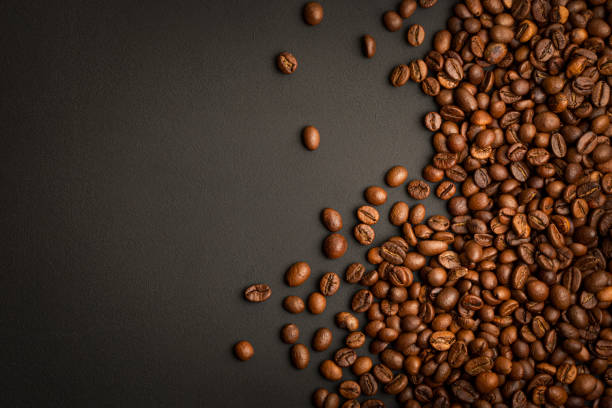 istock Coffee Beans on Black Table. Top View Background with Copy Space 1371381301