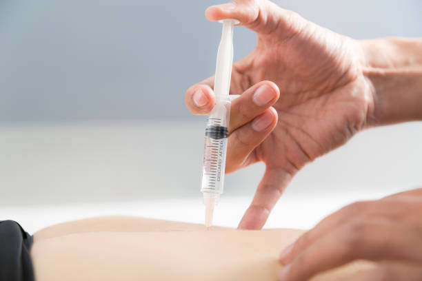 istock The doctor injects trigger points in the girl's back 1371383422