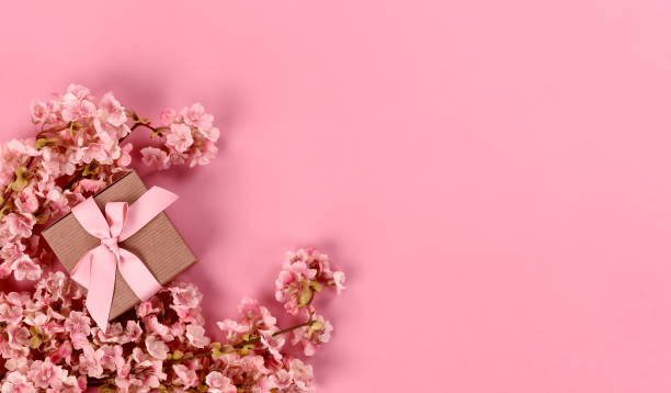 istock Spring time cherry blossoms and giftbox on light pink background for a Mothers Day or Easter holiday 1371384353