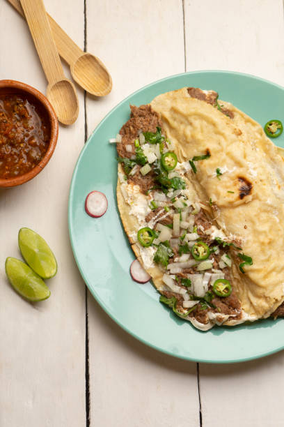istock Quesadilla with beef barbacoa and sauce. Mexican food 1371385935