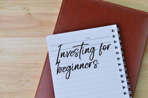 istock Top view of notebooks written with text INVESTING FOR BEGINNERS. 1371388674