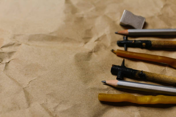 Tools for decorating Paschal eggs, Pysankas. Rustic background. Collection pens and pencils. Homemade pen for drawing eggs. Preparation for holiday. Craft paper. Ukrainian tradition. Copy space.