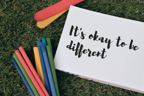 istock Notebook written with IT'S OKAY TO BE DIFFERENT. Top view. 1371391878