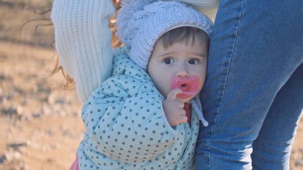 Baby girl with mother for a walk in nature.