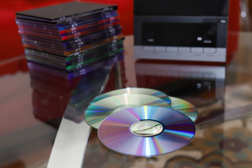 A stack of audio CD disk  sitting on a table