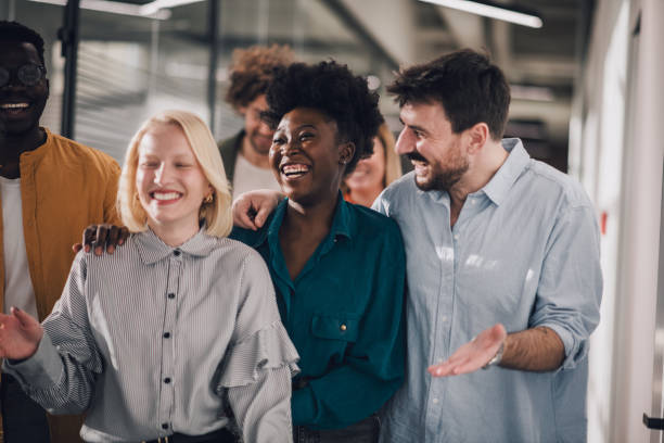 istock Group of young colleagues having fun on work brake 1371402335