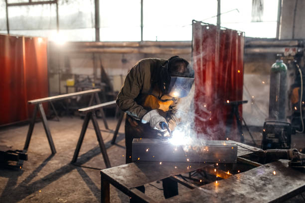 istock Men welding metal in workshop 1371408489