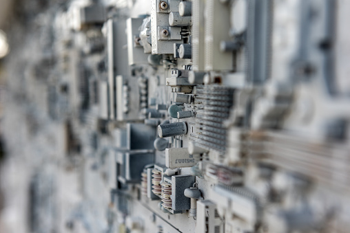 Background with old electronic circuits that look like cities lost in the snow seen from above.