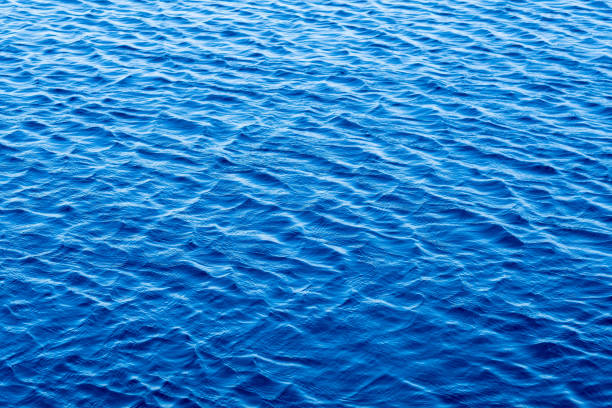istock surface of water, blue wave background 1371410642